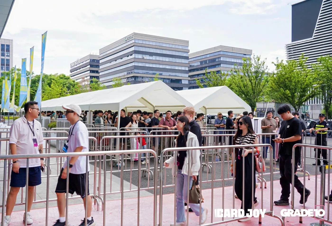 Collectors arriving outside a Card Joy and Grade10 event venue.